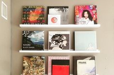 a white shelf with many books on it