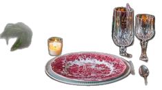 an assortment of glassware and candles on a table