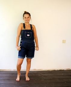 "Vintage denim short Cutoffs overalls in dark blue, cotton, buttons on each side, adjustable straps, pockets, high waist fit. original tag intact, the length has been cutoffs. aside from minor signs of wear, good vintage condition. clean ready to wear. Model is 5′ 0.2″ - 153cm and size XS-S for reference ** Approximate size:S- please refer to the measurements M E A S U R E M E N T S - were taken with garments laying flat, please double where necessary. ------------------------♥-------- length:33 Cotton Overalls With Pockets In Short Length, Short Cotton Overalls With Pockets, Cotton Short Overalls With Pockets, Denim Blue Shortalls With Pockets, Dark Wash Denim Shortalls, Dark Wash Cotton Shortalls With Pockets, Medium Wash Short Length Cotton Overalls, Denim Blue Shortalls, Utility Denim Blue Cotton Shortalls