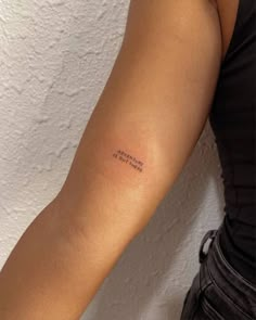 a woman's arm with a small tattoo that reads, i am sorry to you