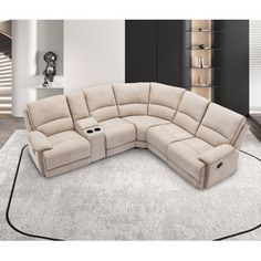 a beige sectional sofa with recliners on top of it in a living room