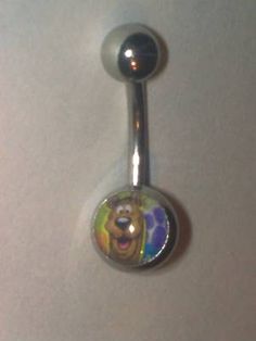 a belly button with a cartoon character on it's side and a ball in the middle