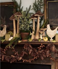 a mantel decorated with pine cones and mushrooms