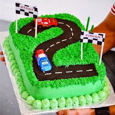 a birthday cake with cars on it