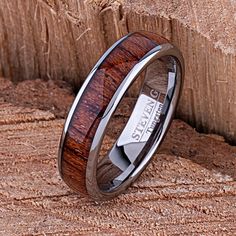 a wedding ring with a wooden inlay