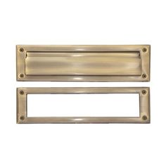 two brass door handles on a white background