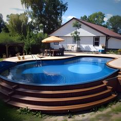 an above ground pool with steps leading up to it and a deck in the background