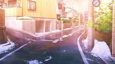 an image of a street with snow on the ground and buildings in the backround