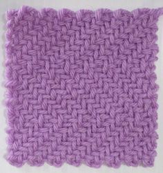 a purple crochet square is shown on a white surface