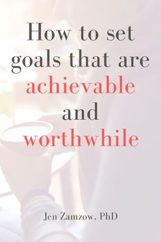 a person holding a cup with the words how to set goals that are achieving and worth while