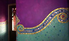 a bathroom with purple walls and colorful tiles