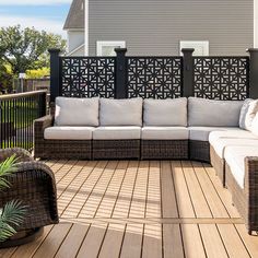 a couch and some chairs on a wooden deck