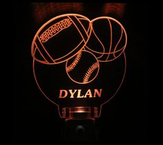 a lighted sign with three baseballs and the word dyllan on it in red