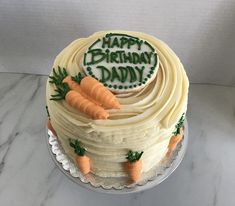 a birthday cake decorated with carrots and the words happy birthday daddy