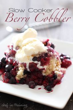 a close up of a plate of food with ice cream and berries on it,