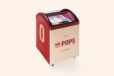 a red and white mr pops machine sitting on top of a table