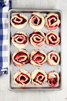 a pan filled with pastries on top of a table