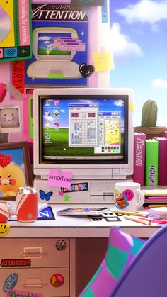 a desktop computer sitting on top of a desk next to a pile of books and toys