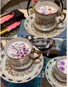 three pictures of cups and saucers with flowers on them