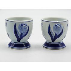 two blue and white cups with flowers on them