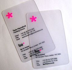 two white tags with pink flowers on them