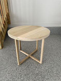 a wooden table sitting on top of a carpeted floor