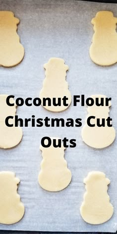 coconut flour christmas cut outs on a baking sheet with the words coconut flour christmas cut outs