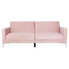 a pink couch sitting on top of a white floor