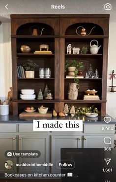 an open bookcase in the middle of a kitchen