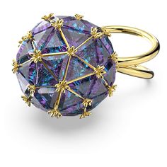 a large purple ring with gold accents on the sides and an intricate design in the middle