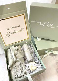 the bridesmaid gift box is open and ready to be packed