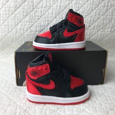 Brand new with box but missing lid. No lid. Air Jordan 1 Retro High OG (TD) Toddler Kids Shoes SZ 4C Satin Bred FD5305-061 Missing lid. Step up your toddler's shoe game with the Air Jordan 1 Retro High OG (TD) in black, university red, and white colorblock pattern. These unisex baby and toddler sneakers are perfect for travel, activewear, and casual wear during summer, fall, and spring seasons. They feature a lace-up closure, high top shoe shaft style, and standard shoe width for a comfortable fit. The shoes also come with the iconic Jordan logo and are made of satin fabric type. They are perfect for walking and school activities, and they are available in US shoe size 4C,UK shoe size 3.5, and EU shoe size 19.5 .Get your little one ready for some retro style with the Air Jordan 1 Retro Hig High Top Shoe, Jordan Logo, Toddler Sneakers, Air Jordan 1 Retro High Og, Air Jordan 1 Retro High, Kids Jordans, Air Jordan 1 Retro, Jordan 1 Retro High, Jordan 1 Retro