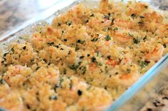 a casserole dish filled with meat and vegetables on top of a countertop