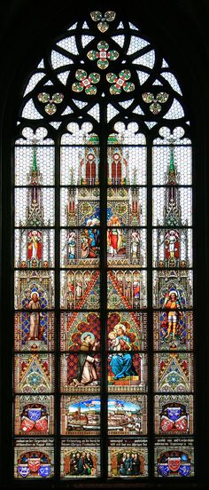 an ornate stained glass window in a church