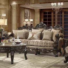 an ornate living room with fancy furniture and chandelier