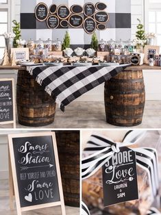 the table is set up with black and white decorations, chalkboard signs, and wooden barrels