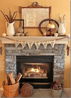 the fireplace is decorated with autumn decorations and buntings on it's mantle