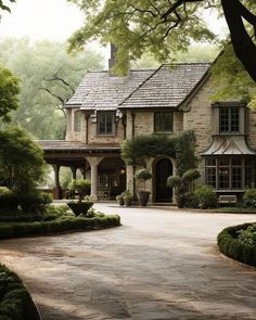 a large house surrounded by lush green trees