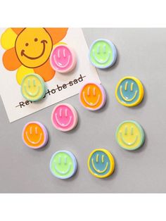 several smiley face buttons on top of a piece of paper with the word free to be used