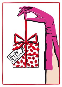 a woman's hand holding a gift wrapped in red and white paper with a happy birthday tag on it