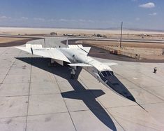 a jet sitting on top of an airport tarmac