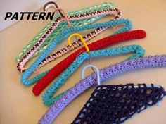 crocheted clothes hangers with hooks on them