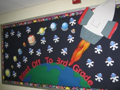 a bulletin board with a rocket on it