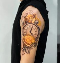 a man with a clock and roses tattoo on his arm