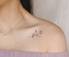 a woman with a small tattoo on her shoulder