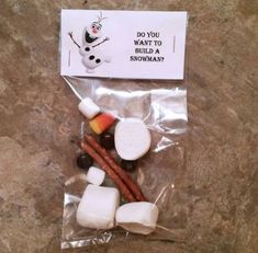 some candy sticks and marshmallows are in a bag