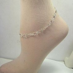 Gorgeous, lacy handcrafted links that look like little ankhs (or angels if you turn them upside-down!) Made with sterling silver wire. This unique anklet closes with a sturdy sterling silver spring ring. A sweet, feminine gift for graduation or a special birthday. Choose your custom variation for a perfect, comfortable fit! Delicate Adjustable Silver Anklets, White Metal Anklet Perfect For Gifting, White Metal Anklet As Gift, White Metal Anklets For Gift, Dainty Handmade Anklets As Gift, Dainty Handmade Anklets For Gift, Dainty Handmade Anklets For Gifts, Handmade Dainty Anklets As Gift, Bohemian Sterling Silver Anklets For Gift