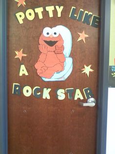 a door with the words potty like a rock star painted on it