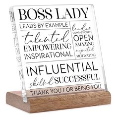 a clear acrylic plaque with the words boss lady written in black on it