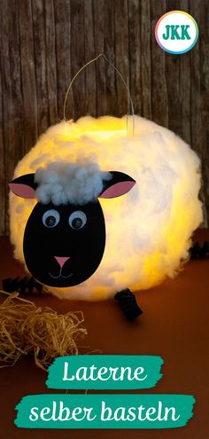 a light up sheep is sitting on top of some hay with the words, latene selben basteln